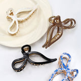 JUMBO CELLULOSE CASTING BOW HAIR CLAW CLIPS | 40H759